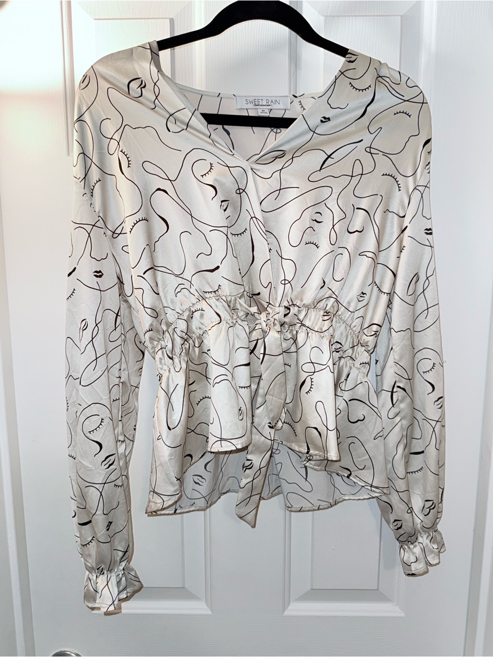 Sweet Rain Cream and Black Abstract Line-Print Peplum Blouse